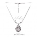 Silver clover necklace on a white string.