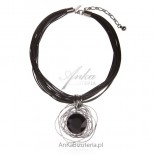 Trendy women's jewelry. Necklace on black strings