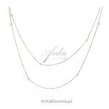 A beautiful long silver necklace with pearls