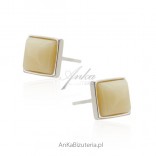 Silver earrings with amber in a white - yellow shade