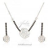 A set of silver jewelry with black zircons - roses