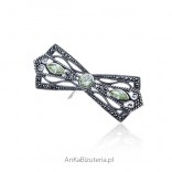 Silver brooch with marcasites and olivine