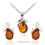 A set of silver jewelry with amber