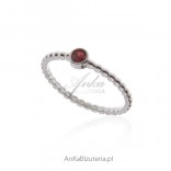 Silver ring with red zircon