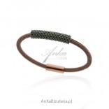 A bracelet made of stainless steel with green Swarovski crystals