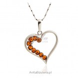 Silver pendant with hearts and ambers