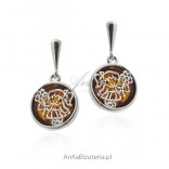 Silver earrings with amber. Girl with flowers