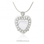 Silver pendant with openwork heart with magnifying crystal