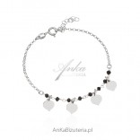 Silver bracelet with onyx and hearts