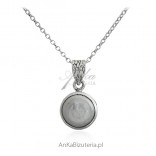 Silver pendant with a natural pearl of irregular shapes
