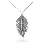 Silver pendant, oxidized feather.