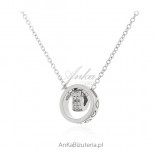 Silver necklace with "dancing heart" and cubic zirconia