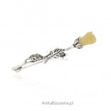 White rose. Silver brooch with white and yellow amber