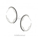 Beautiful silver jewelry. Earrings of silver circles with black zircons