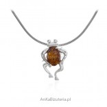 Silver pendant with small frog and amber