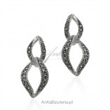 Silver earrings with marcasite hanging.