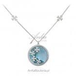 Silver necklace with clover on a light blue pearl