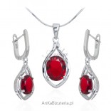 A set of silver jewelry with a red zircon on the English fastener