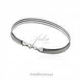 Silver narrow bracelet with a satin strap