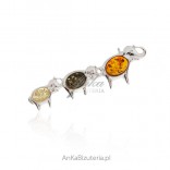 Silver brooch with elephant and amber
