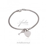 Silver bracelet with a heart and key