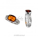 Silver ring with amber with an openwork band