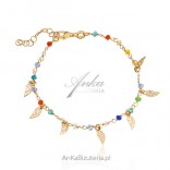 Silver gilded bracelet with colorful zircons and feathers