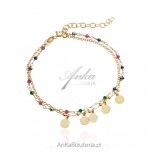 Silver gilded bracelet with small circles and colorful zircons