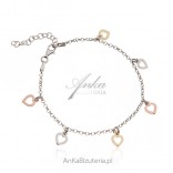 Silver bracelet with hearts in three colors of gold
