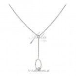 A subtle silver necklace with a tiny zircon