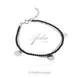 Silver bracelet with black spinels and chain with openwork tags
