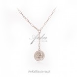 Silver necklace with a coin on an interesting chain