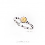 A subtle silver ring with white amber