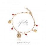 Gold-plated silver bracelet with red spinels and coins
