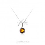 Silver pendant with oxidized amber