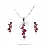 A set of silver jewelry with rubies