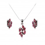 A set of silver jewelry with rubies