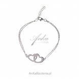 Silver bracelet with two hearts