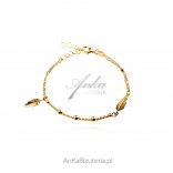 Silver 24k gold plated bracelet with a feather