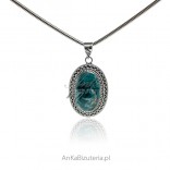 A large silver pendant with a natural apatite stone