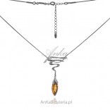 Silver necklace with amber. Elegant feminine necklace with amber