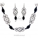 A set of handmade jewelry made of tatting and black stone
