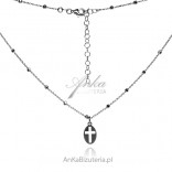 Silver cross necklace in an oval circle