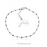 Silver bracelet with black beads FOR THE LEG