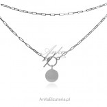 Silver necklace with a tibon circle