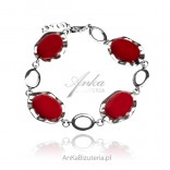 Silver bracelet with a red gemstone