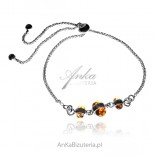 Silver bracelet with amber - pulled with stoppers