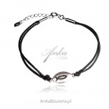 Silver bracelet with a sign of FISH on a black string