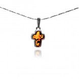 A silver cross with amber - small