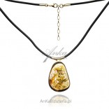 A beautiful gold-plated silver necklace with amber on UNIKAT rubber